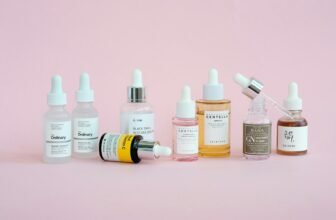 Korean skincare products arranged on a pink background, illustrating an Anua skincare review